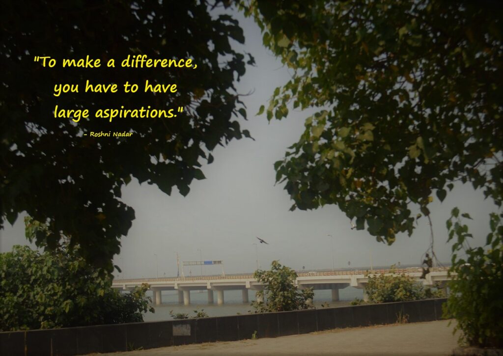 quote by Roshni Nadar on pic of sea-link and a bird flying near trees