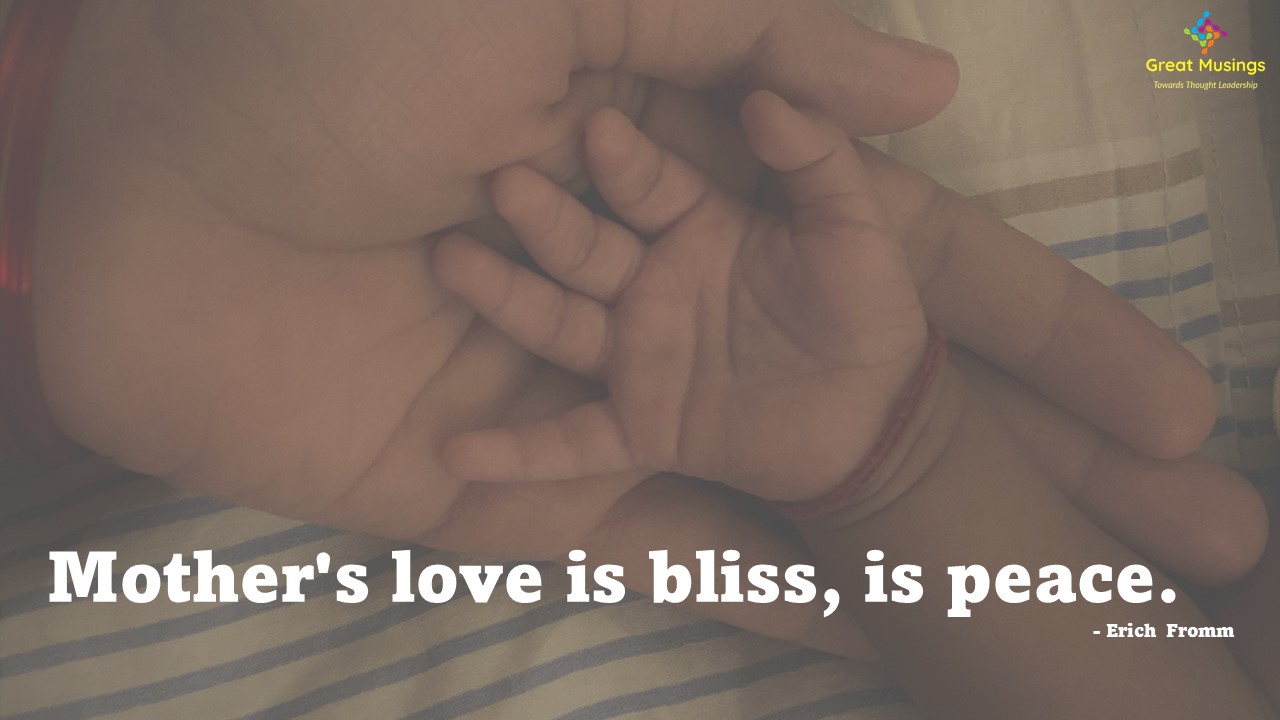 Motherly Quote on image of parent child hands.