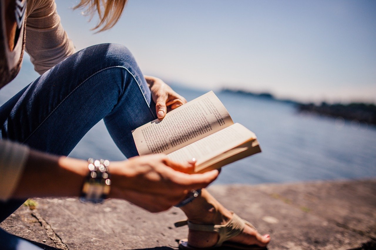 A woman reading a book.